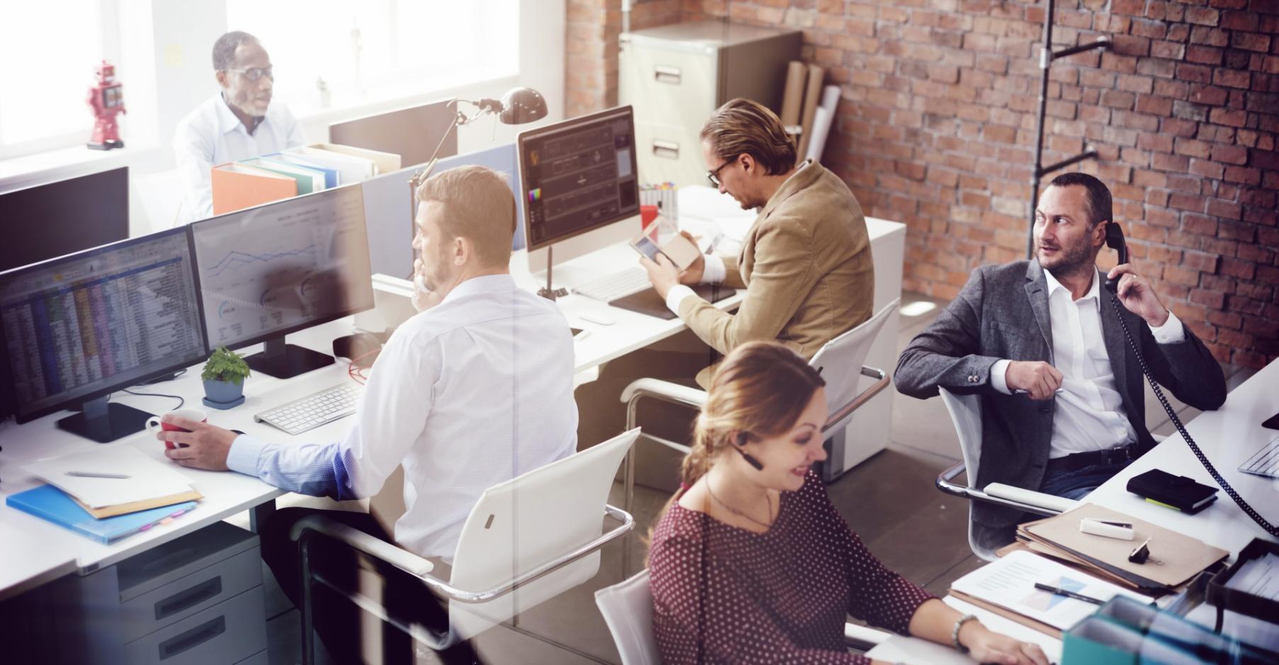 Organized remote learning workspace with computer and study materials